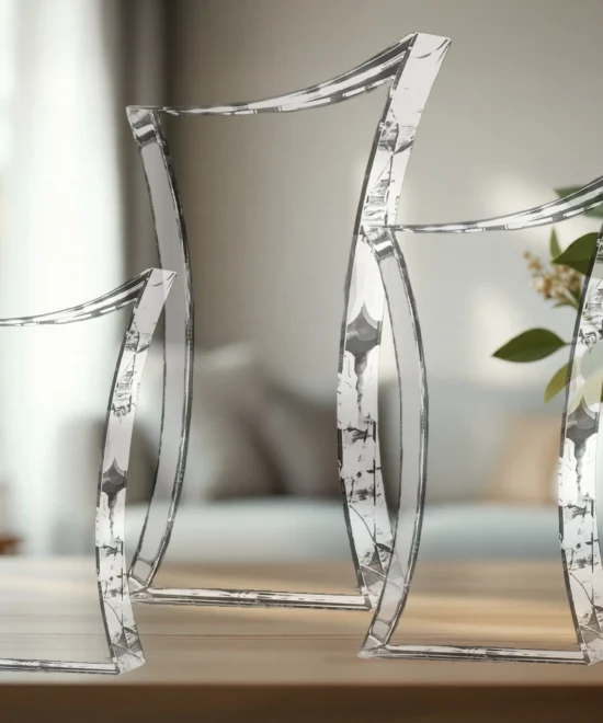 Clear, angular glass-like chairs arranged along a wooden surface in a bright room.
