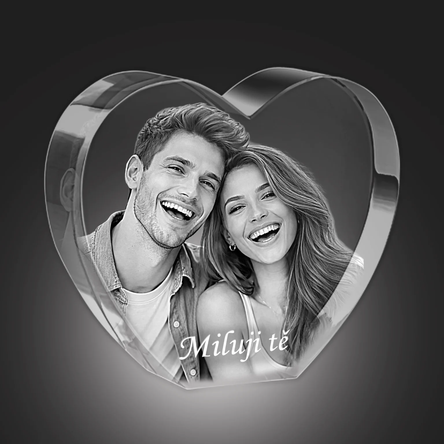 Two smiling people (a couple) in a grayscale photo framed by a large heart, conveying a romantic, cheerful vibe.